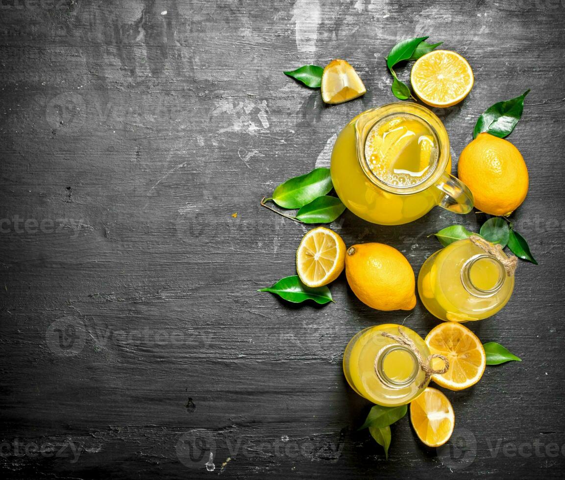 Cold fresh lemonade with slices of ripe lemons. photo