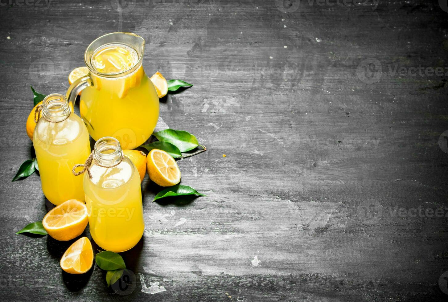 Cold fresh lemonade with slices of ripe lemons. photo