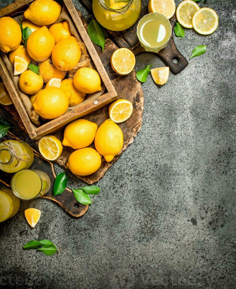 Fresh lemonade from ripe lemons in the box. photo