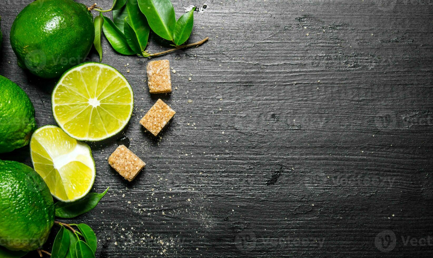 Lime background . Limes, sugar and leaves. photo