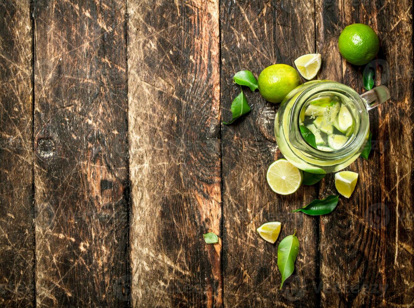 Fresh drink with lime slices. photo