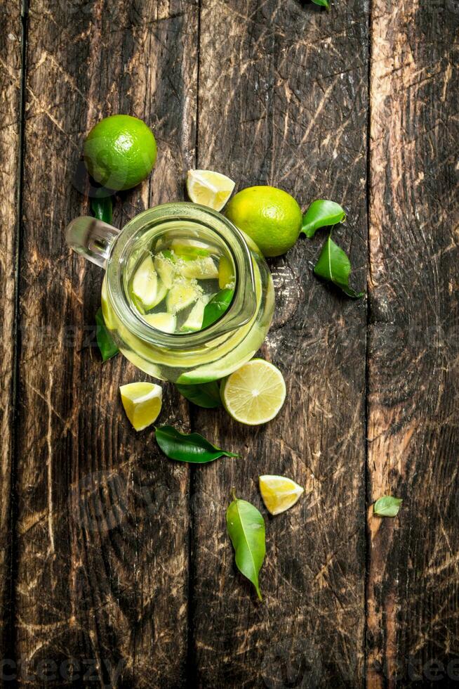 Fresh drink with lime slices. photo