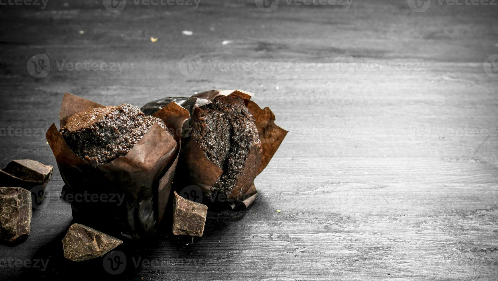 Chocolate muffins with chunks of chocolate. photo
