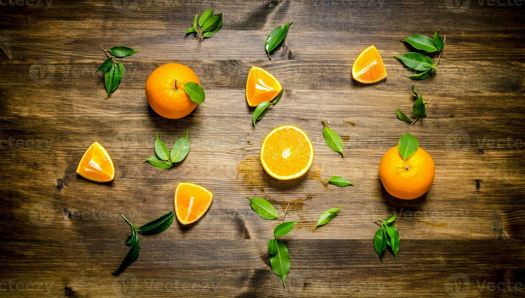 Fresh oranges whole, cut and the leaves. photo