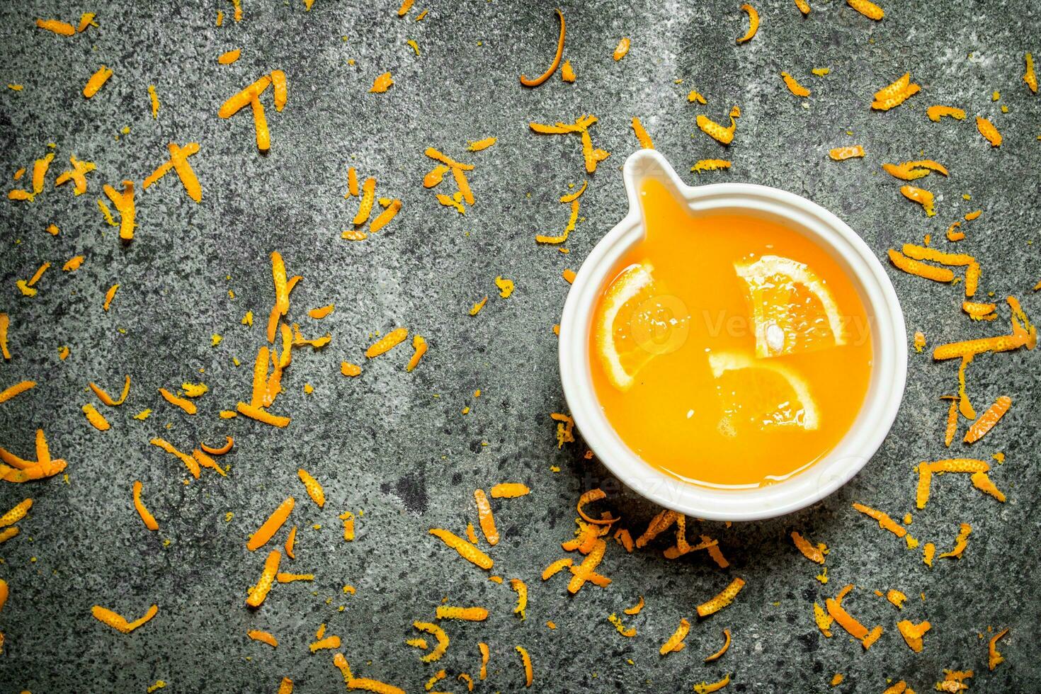 Freshly squeezed orange juice with pieces of fruit . photo
