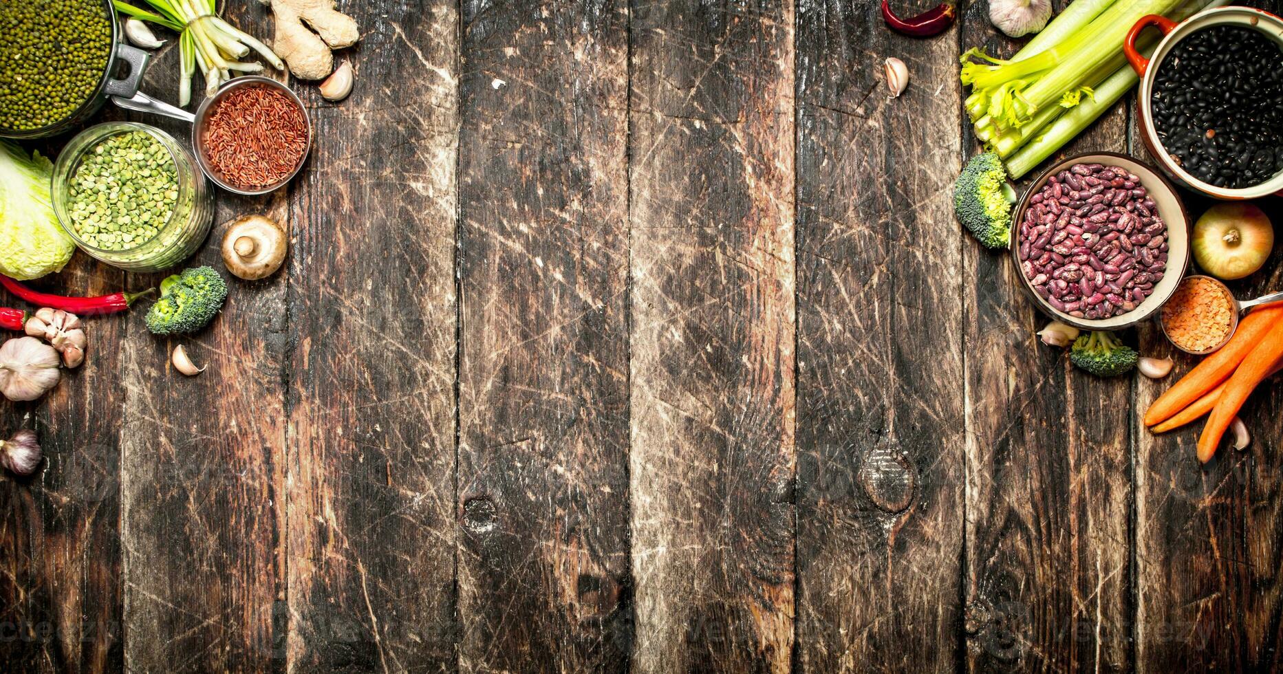 Organic Food. Vegetables and various bean seeds. On the old wooden table. photo