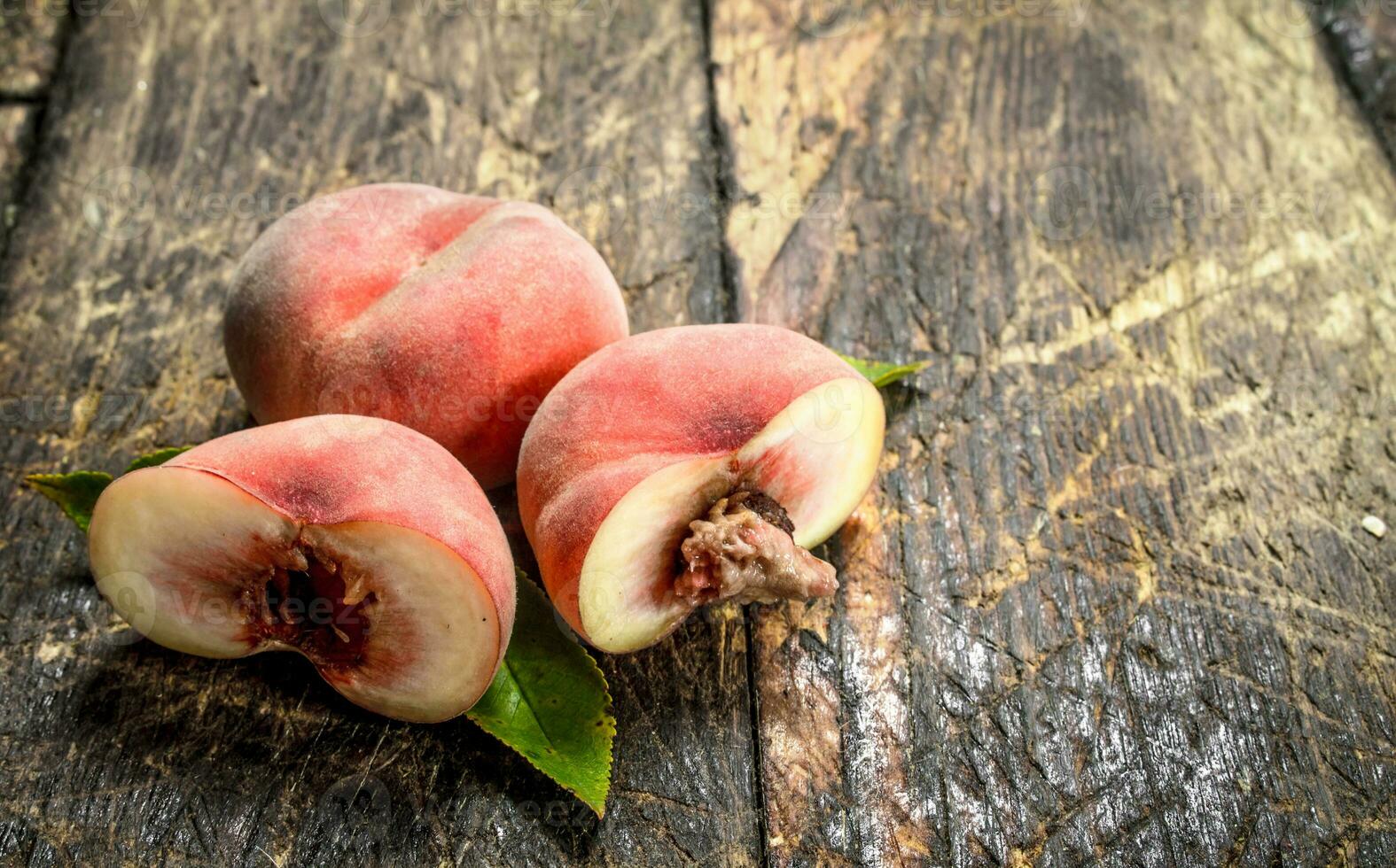 Fresh peaches with leaves. photo