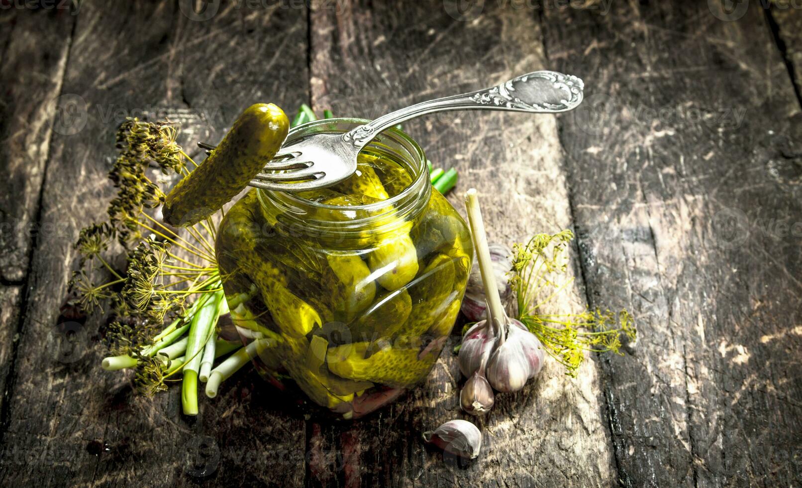 Pickled cucumbers with herbs and spices. photo