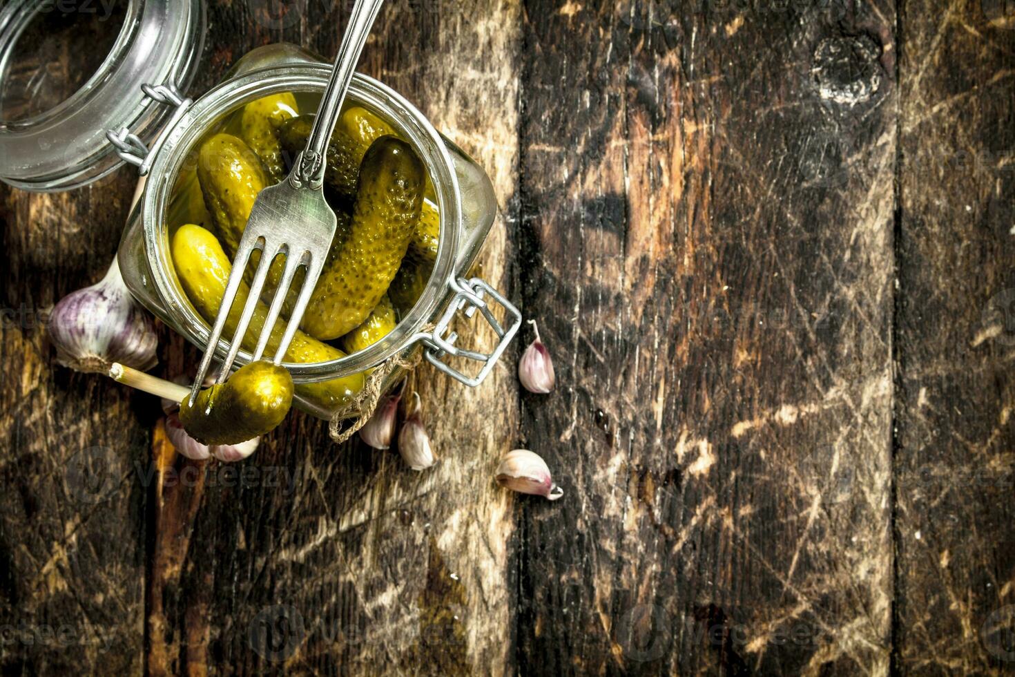 Pickled cucumbers with herbs and spices. photo