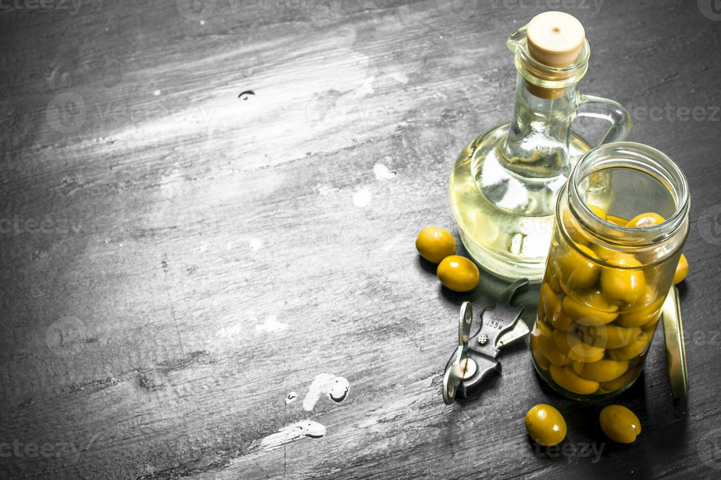 Olive oil. On black chalkboard. photo