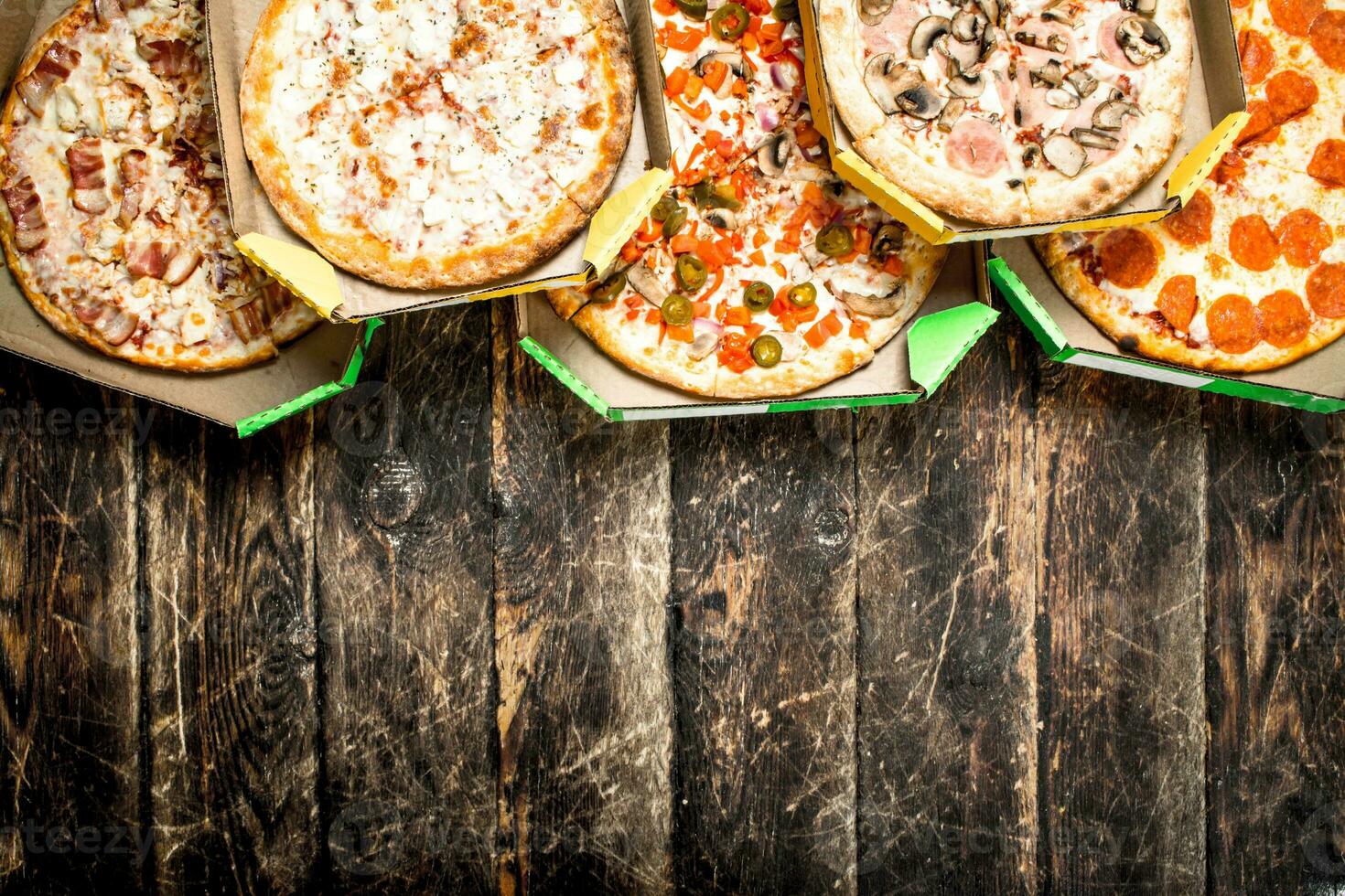Fresh pizza in boxes. photo