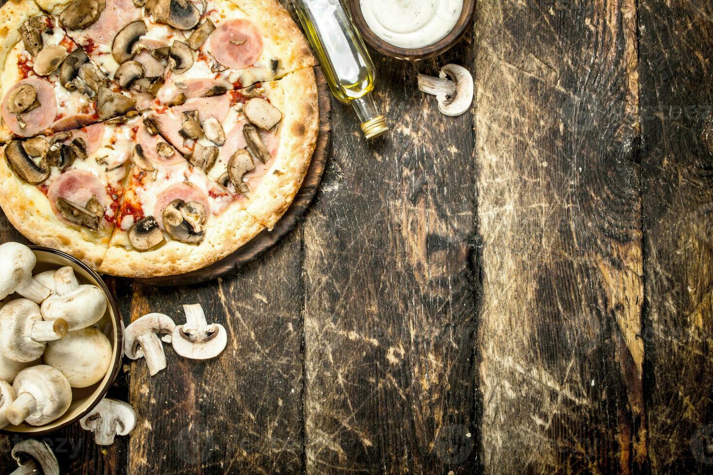 Pizza with mushrooms and ham. photo