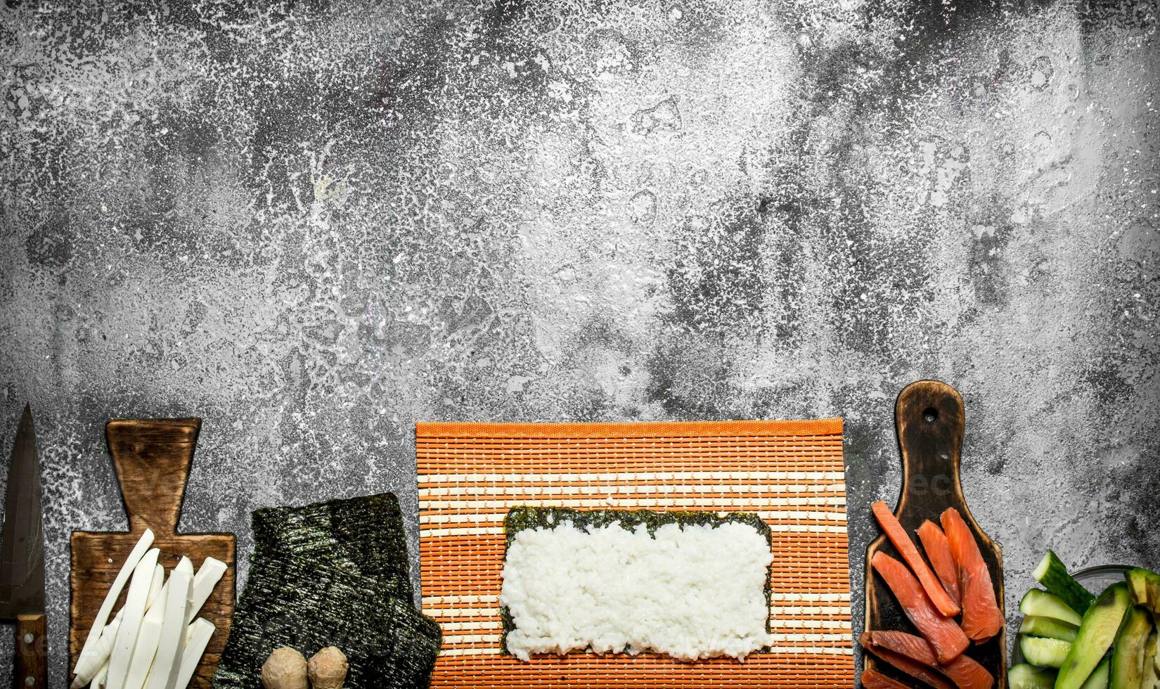 Japanese food. Cooking traditional rolls with fresh seafood. photo