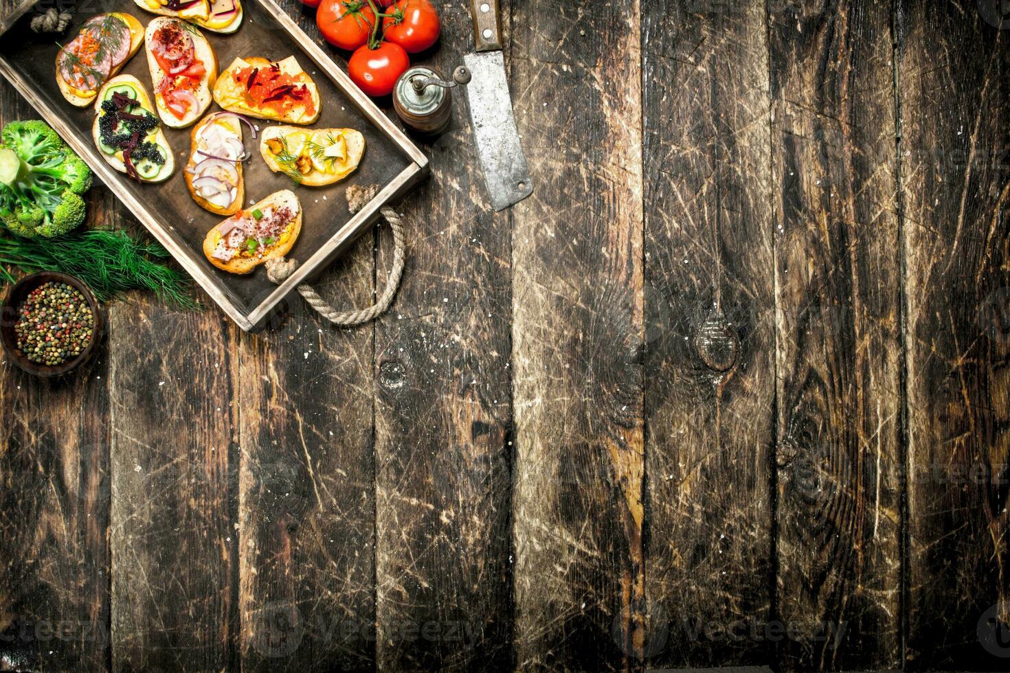 Sandwiches with seafood, salami, bacon and fresh vegetables. photo