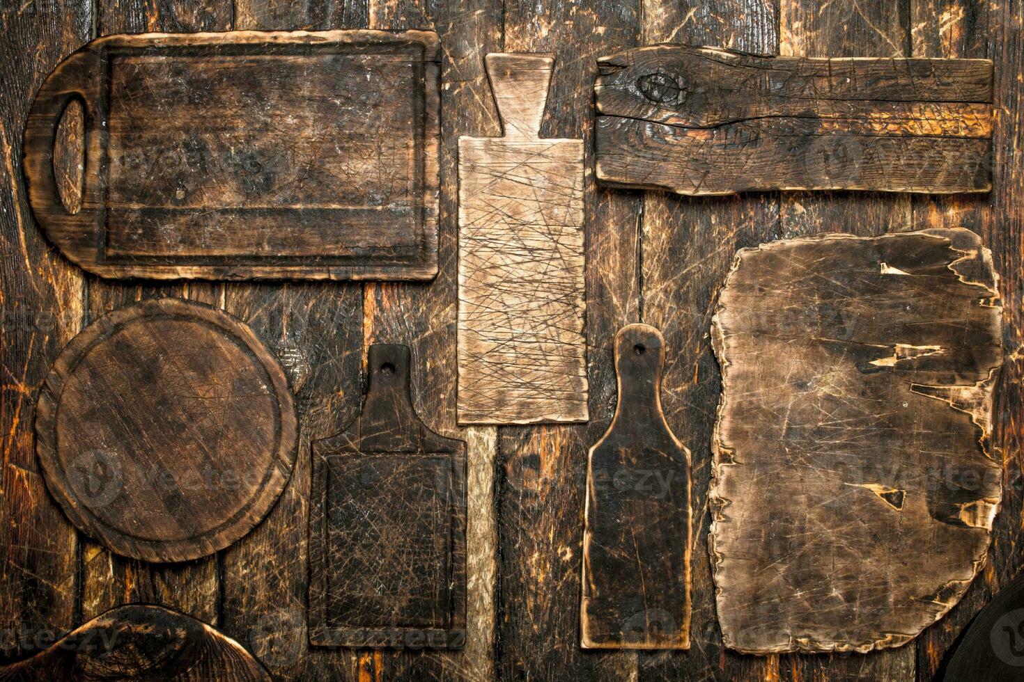 Serving background. Different old cutting Board. photo