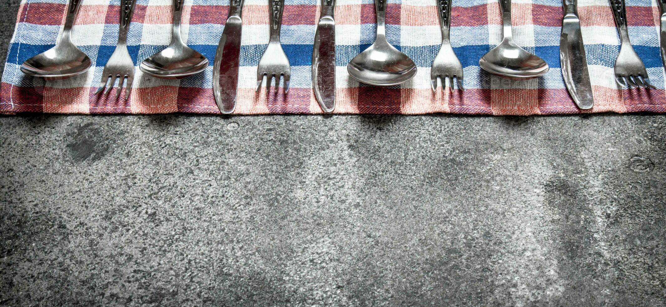 Serving background. Cutlery on a napkin. photo