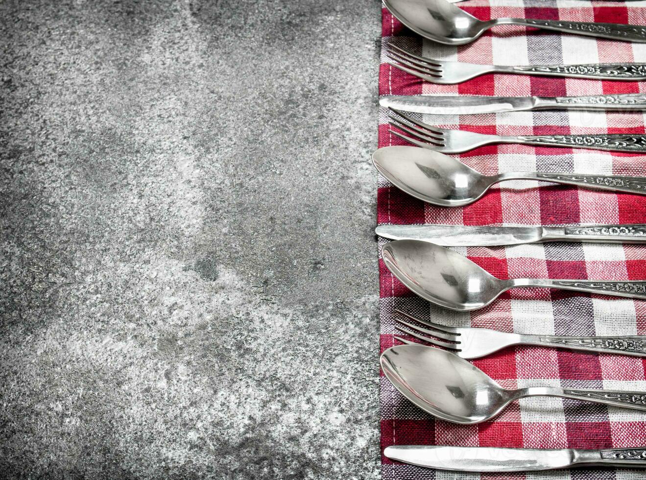 Serving background. Cutlery on a napkin. photo
