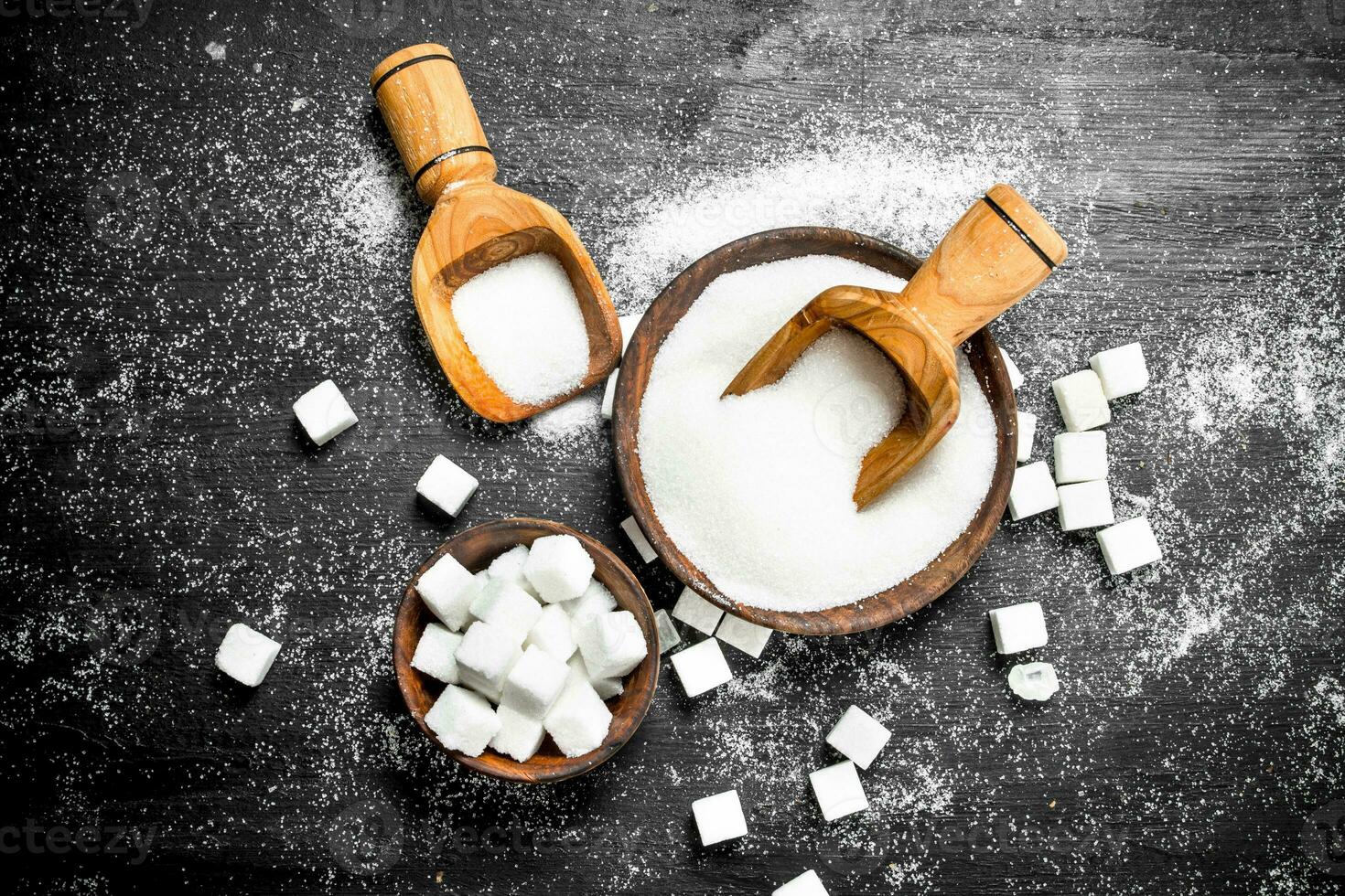 Sugar in a bowl with a scoop. photo