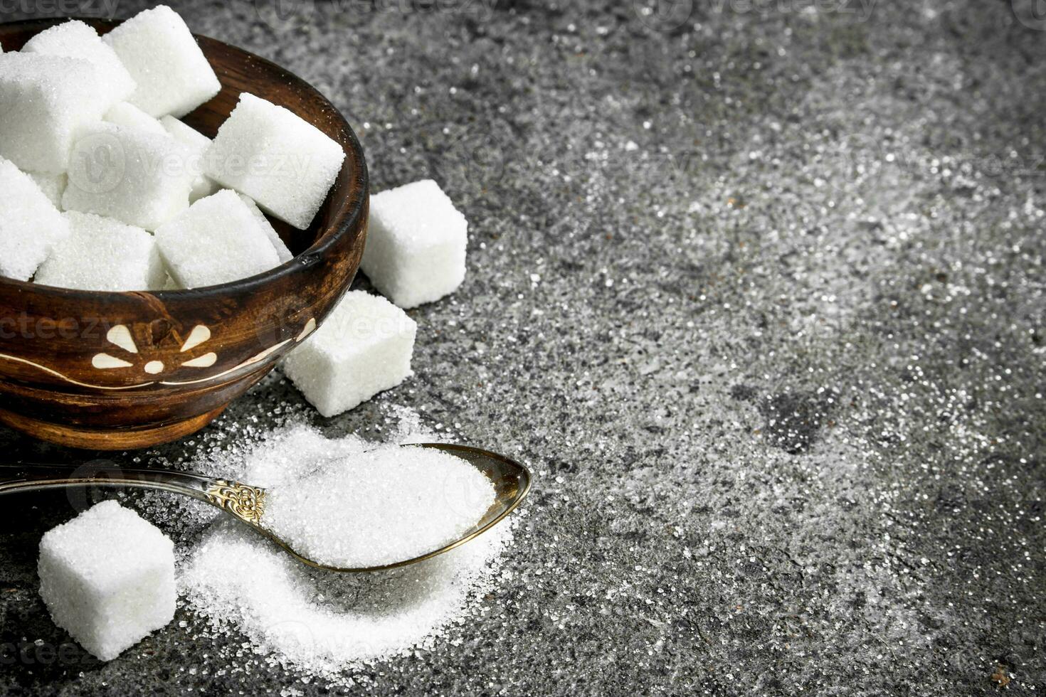 Sugar in a teaspoon. photo