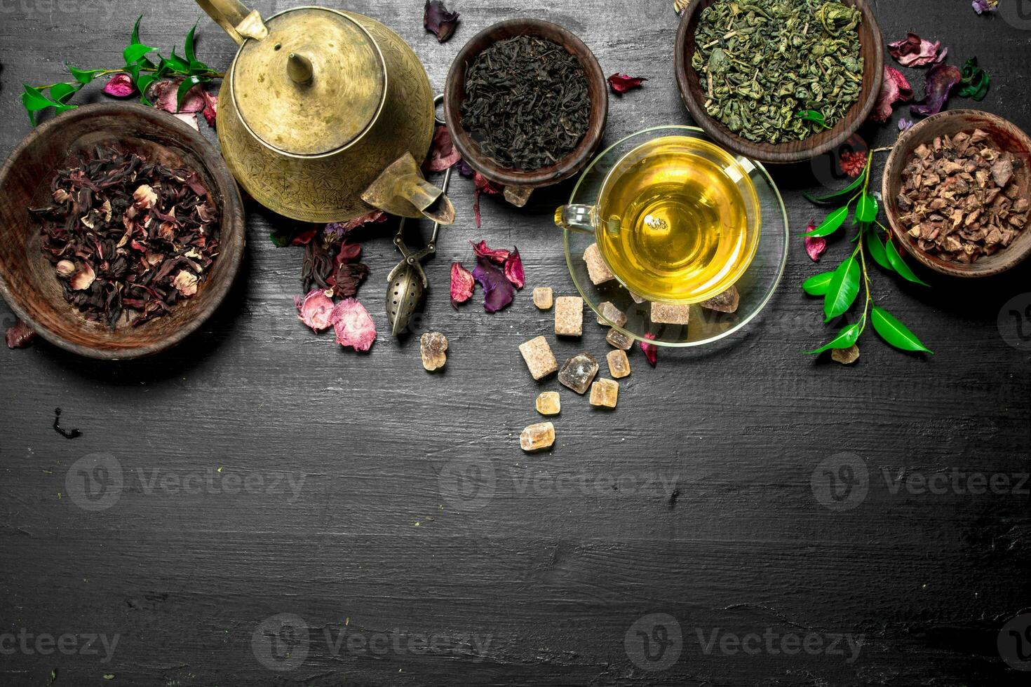 Different kinds of tea with brewed tea. photo