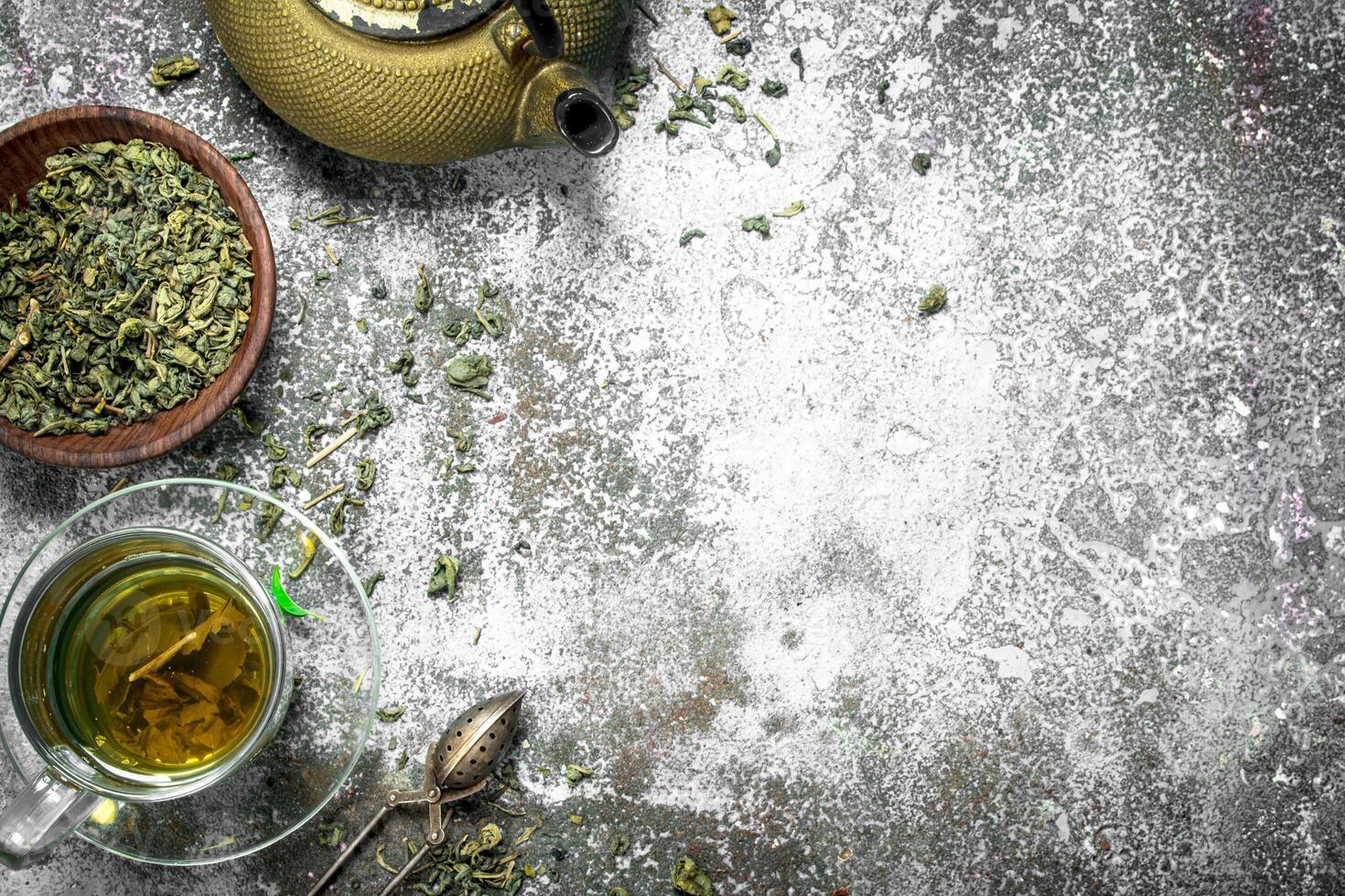 Green tea with a teapot. photo