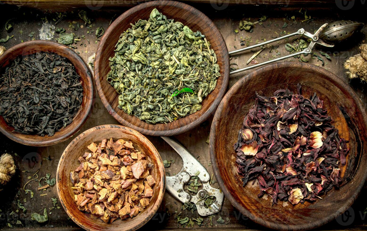 Different kinds of fragrant tea in bowls. photo