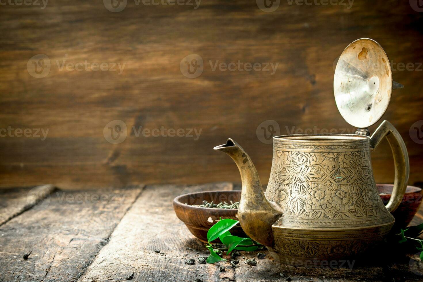 Teapot with fragrant Indian tea. photo