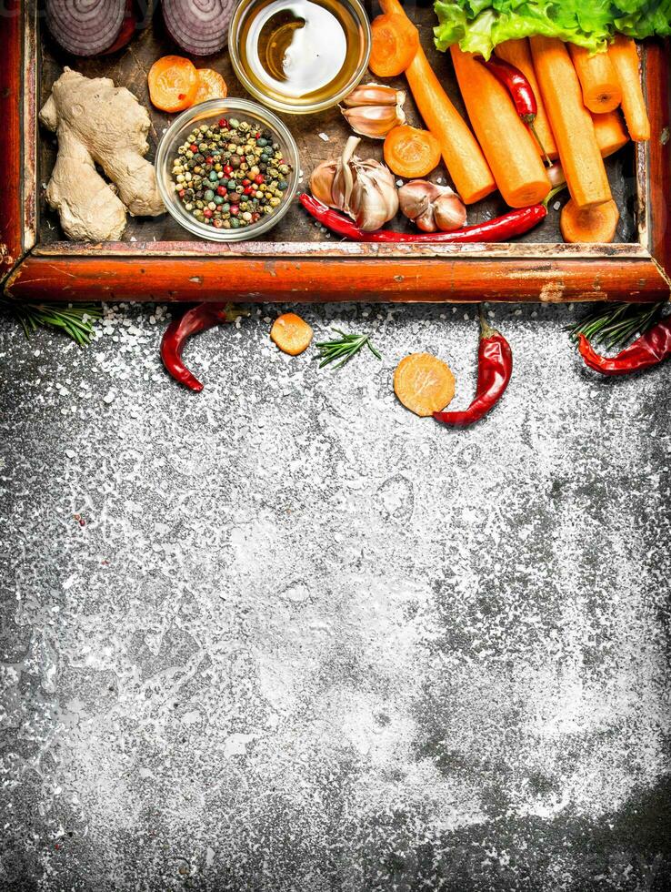 Fresh vegetables . fresh vegetables and herbs in the old tray. On rustic background. photo