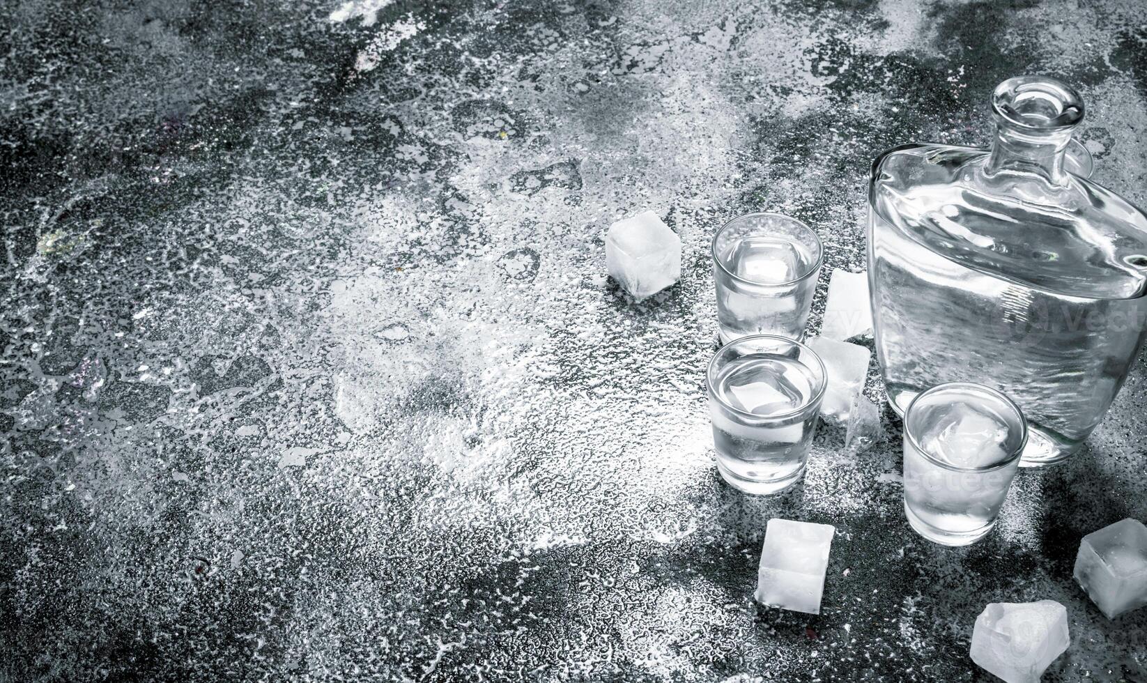 Vodka with ice in glasses. photo