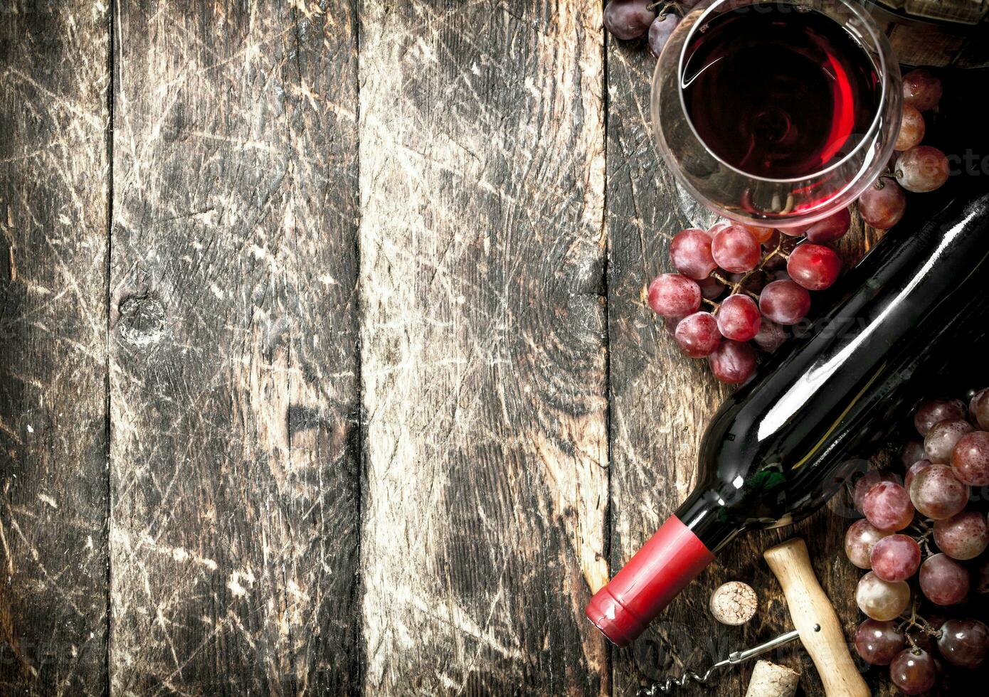 Wine background. Red wine with glasses with grapes. photo