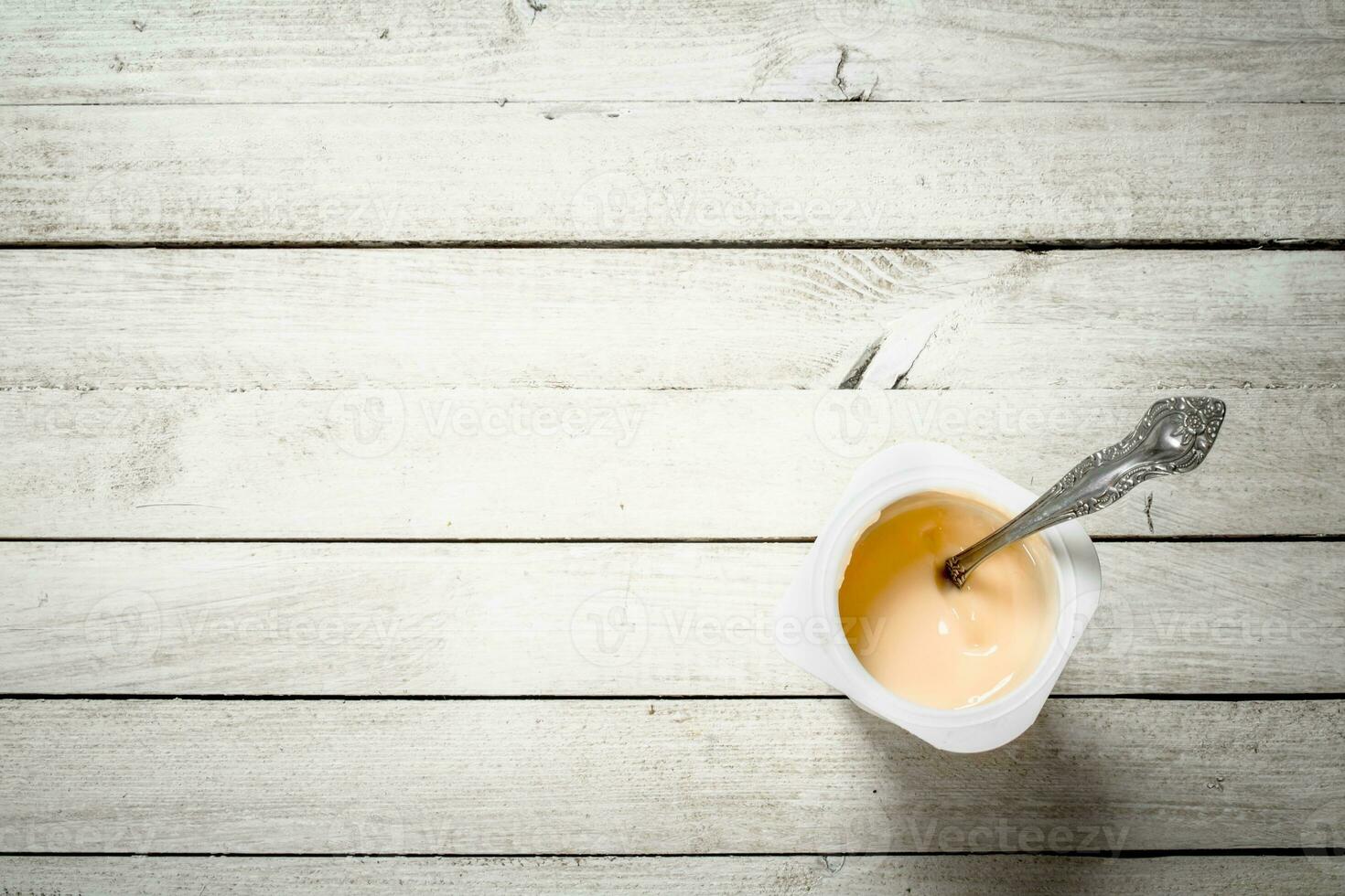 Fruit yogurt with spoons. photo