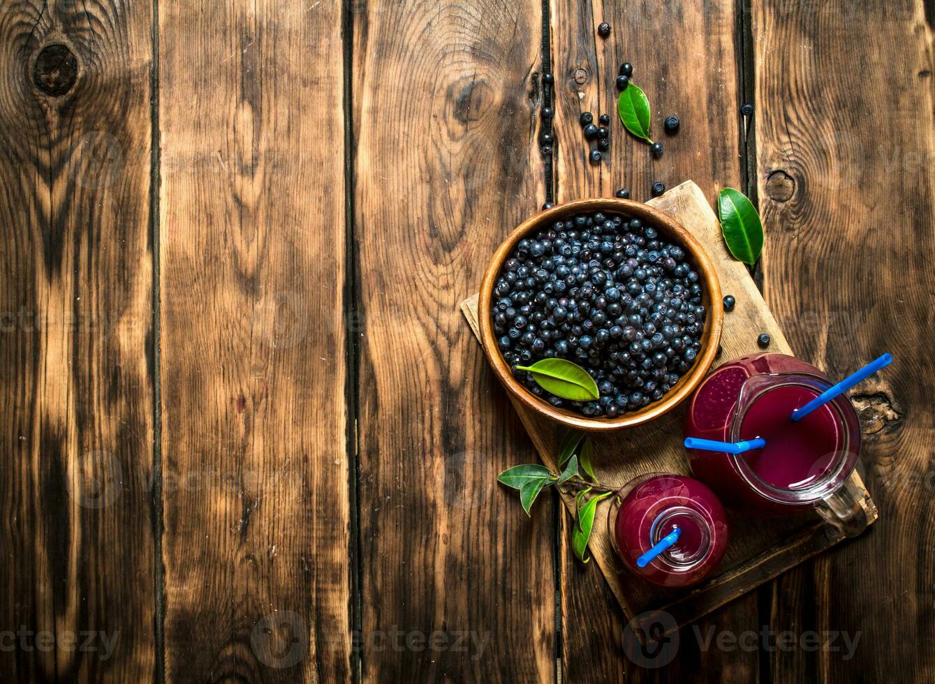 Blueberry juice . On wooden table. photo