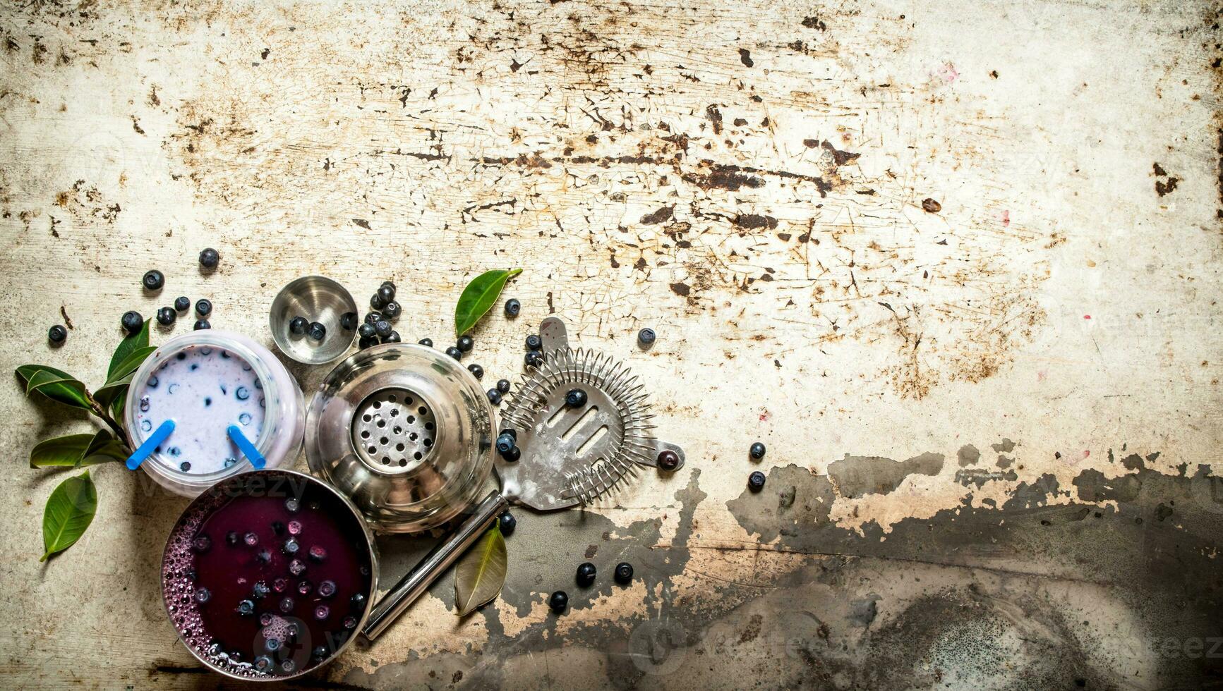 Blueberry smoothies and fresh cocktails. On old rustic background. photo