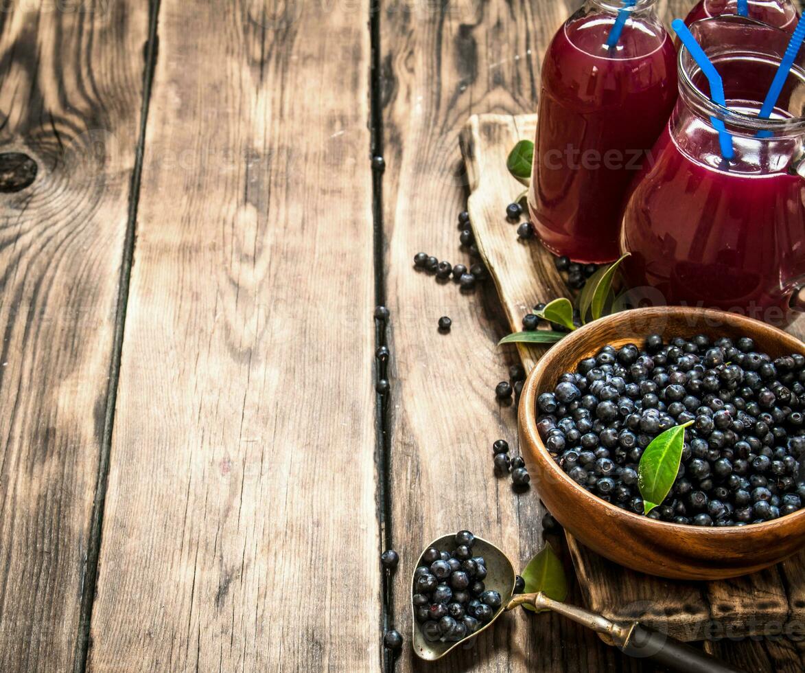 Blueberry juice . On wooden table. photo