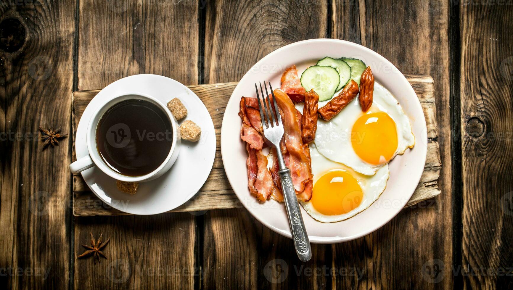fresh Breakfast. Cup of coffee , fried bacon with eggs photo