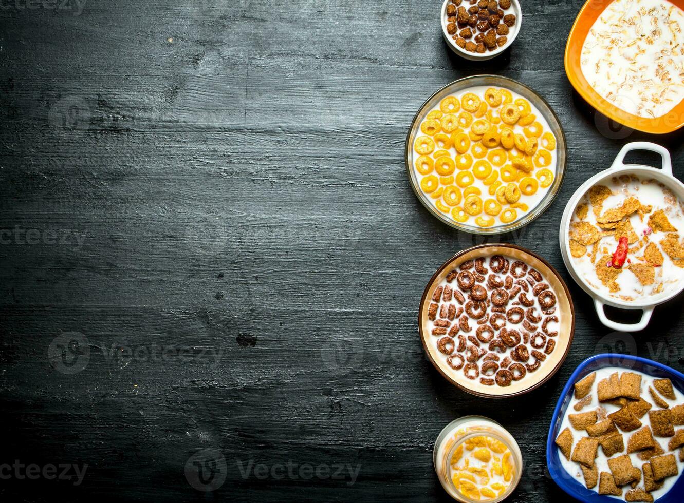 Different cereals with milk. photo