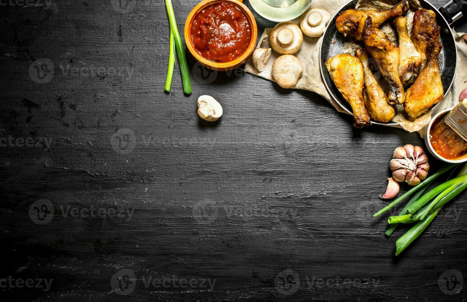 Fried chicken with mushrooms , garlic, onions photo