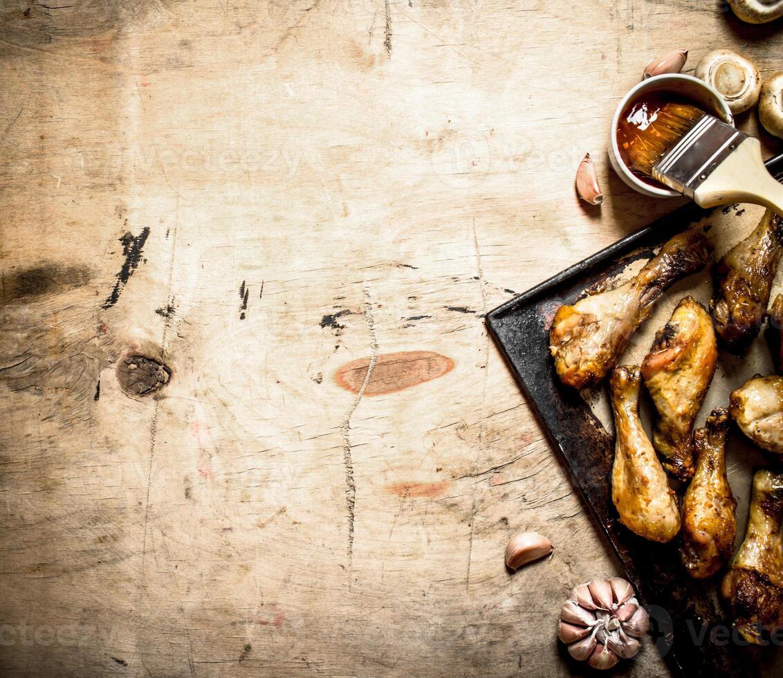 Fried chicken legs in a pan photo