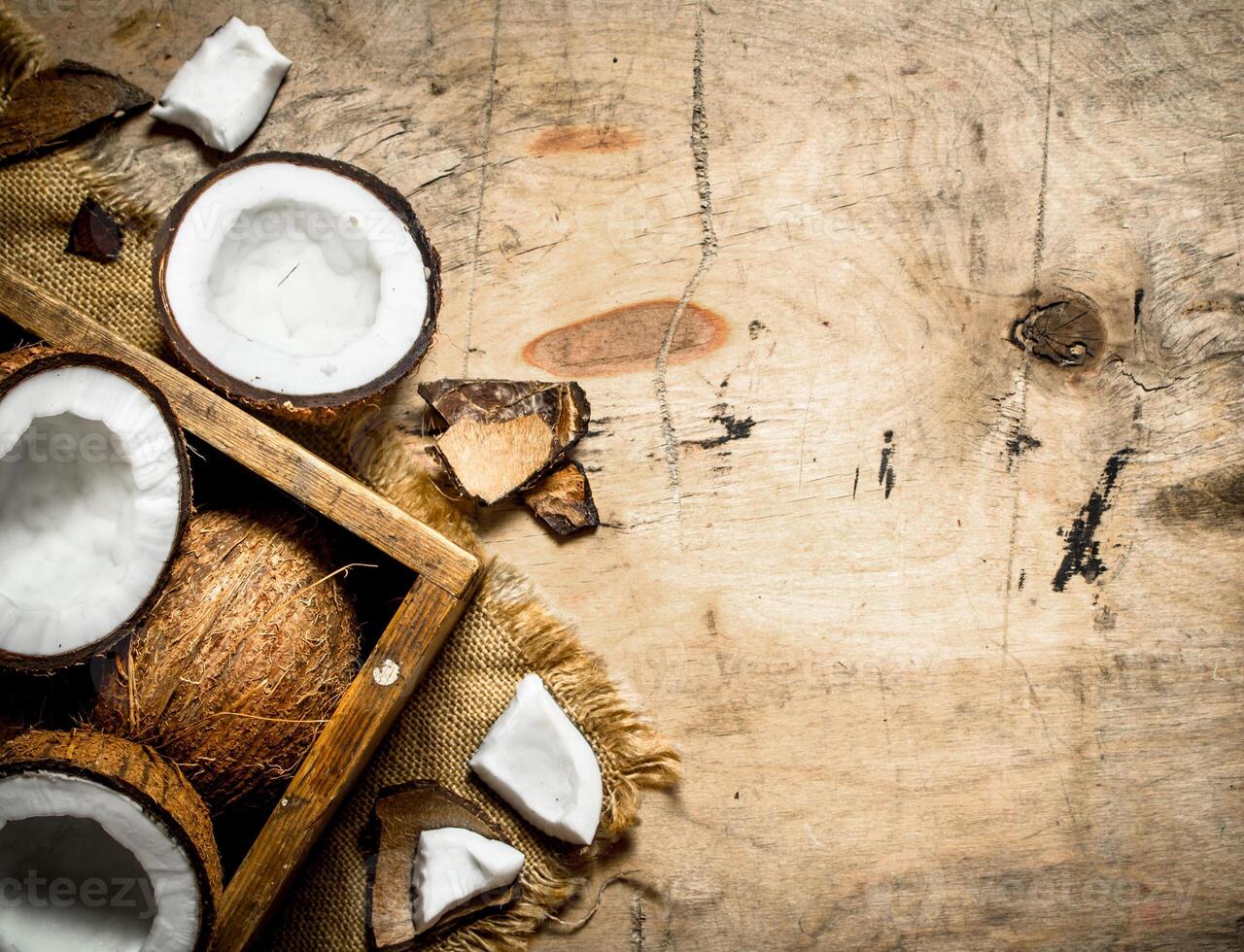 Fresh coconuts in an old box. photo