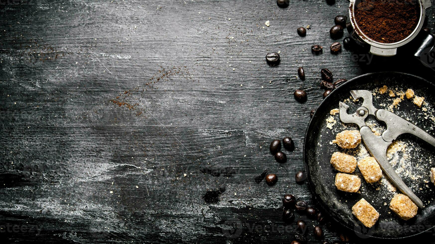 Fresh coffee. Coffee cup with brown sugar and roasted grains . photo
