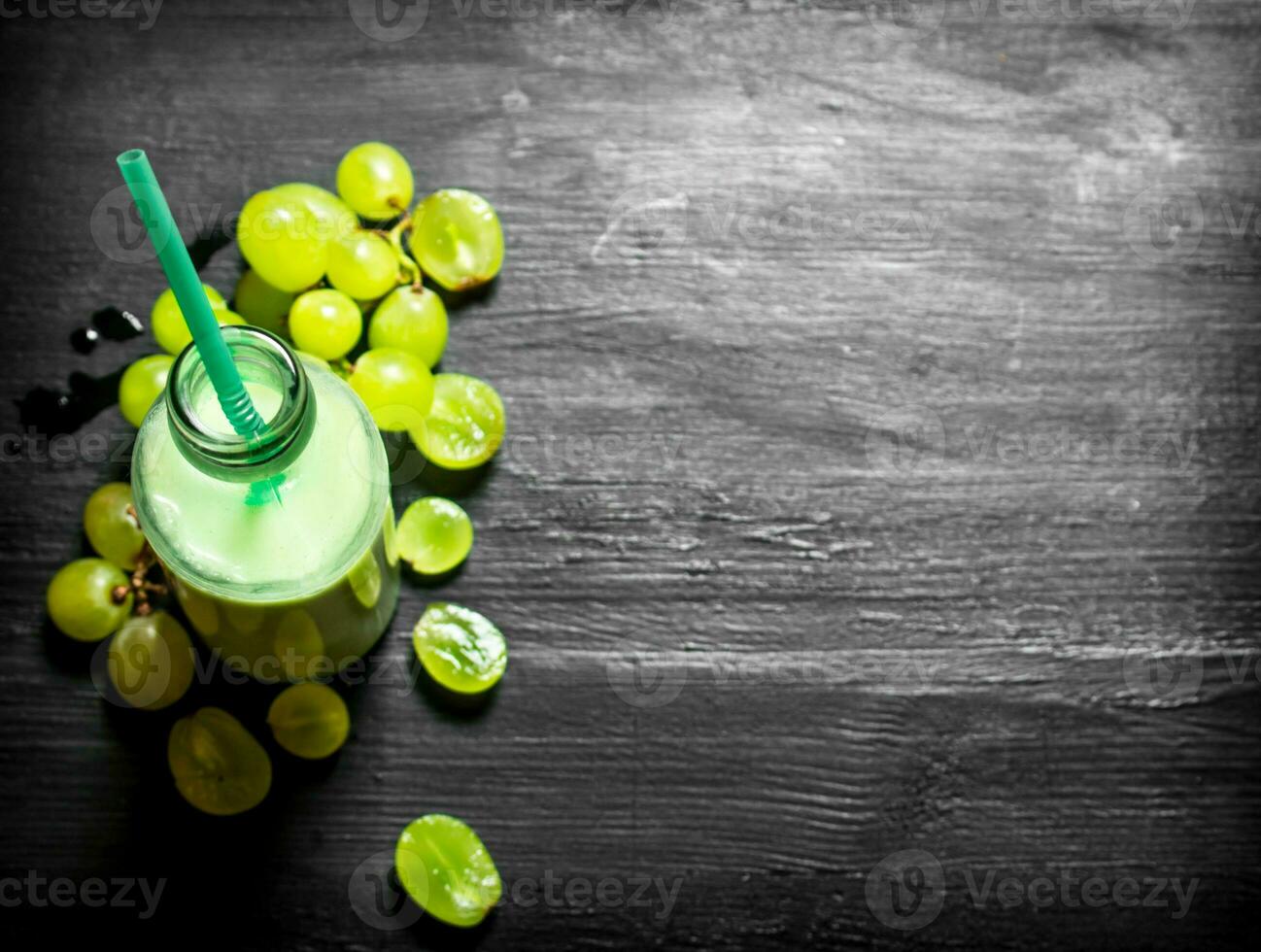 Fresh grape smoothie bottles. photo