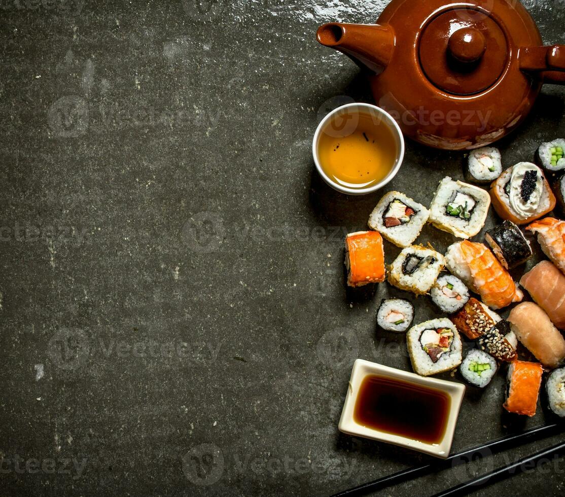 The rolls and sushi with herbal tea. photo