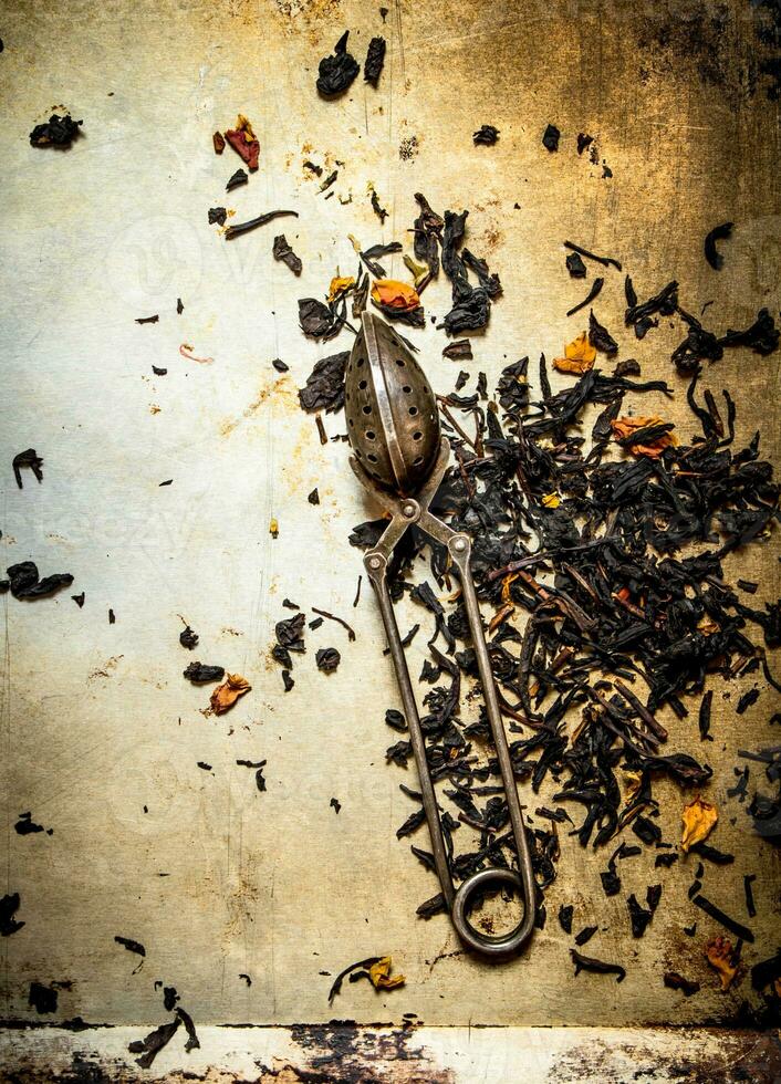 Traditional tea with infuser spoon. photo