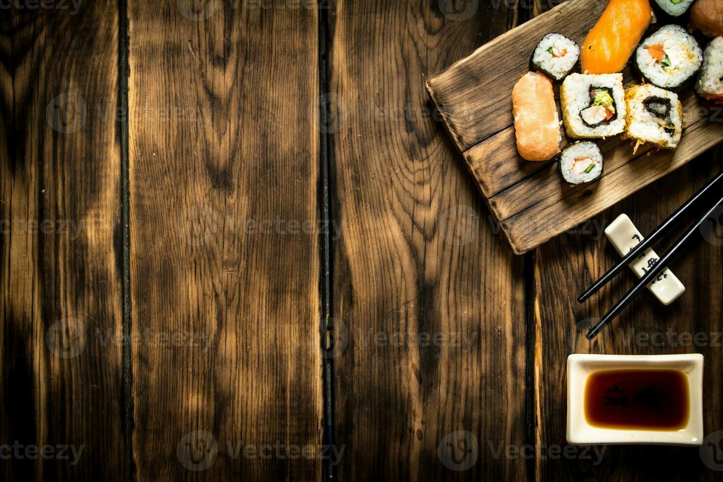 Sushi and rolls seafood with soy sauce. photo