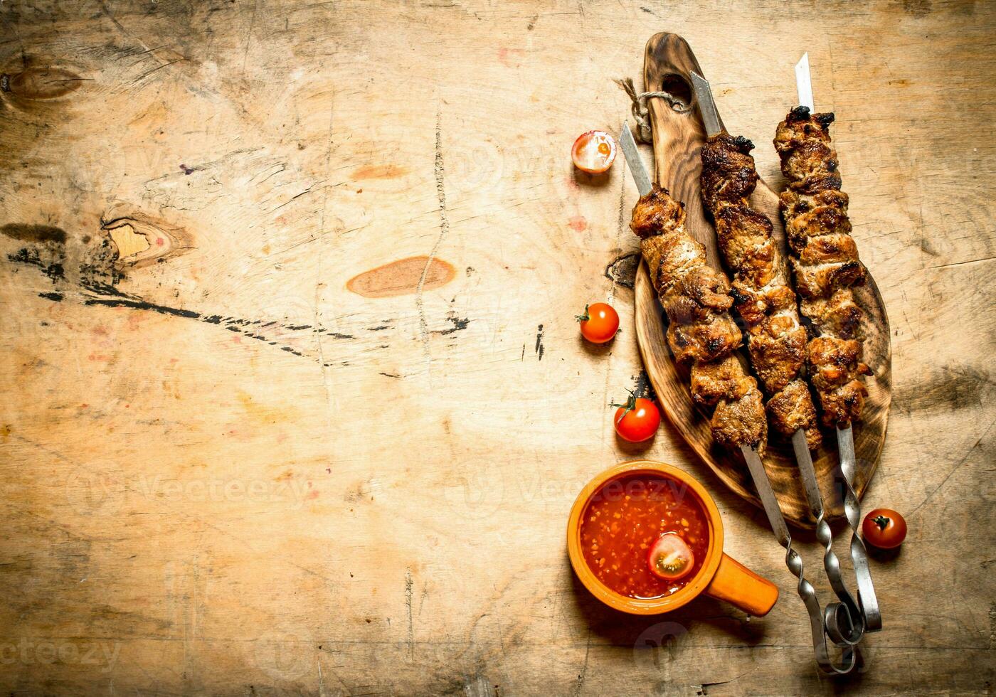 Shish kebab with tomato sauce. photo