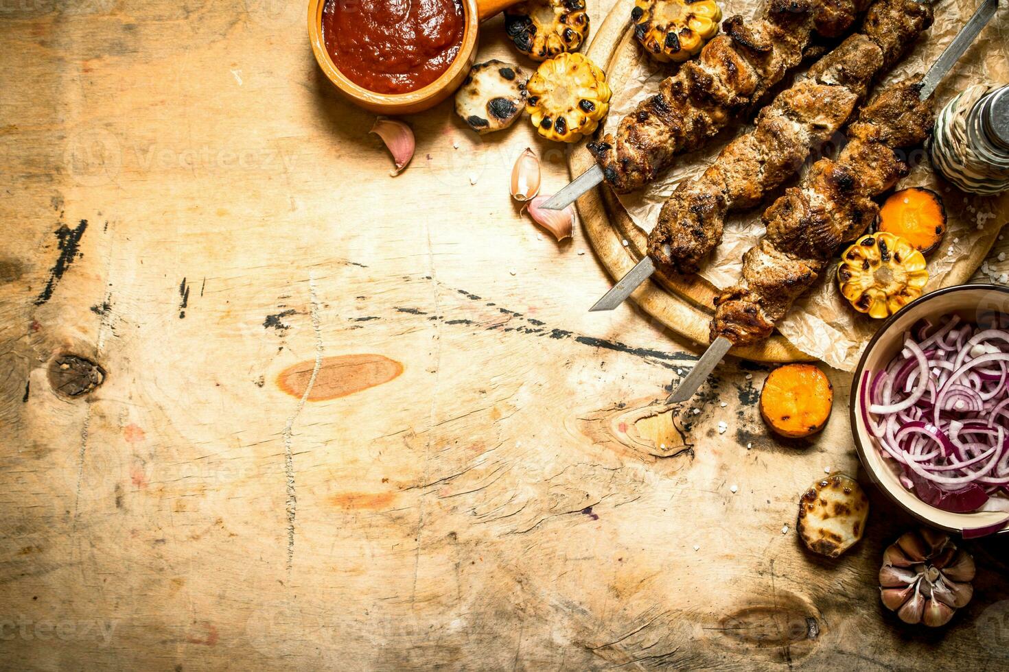 Shish kebab with salad, vegetables and beer. photo
