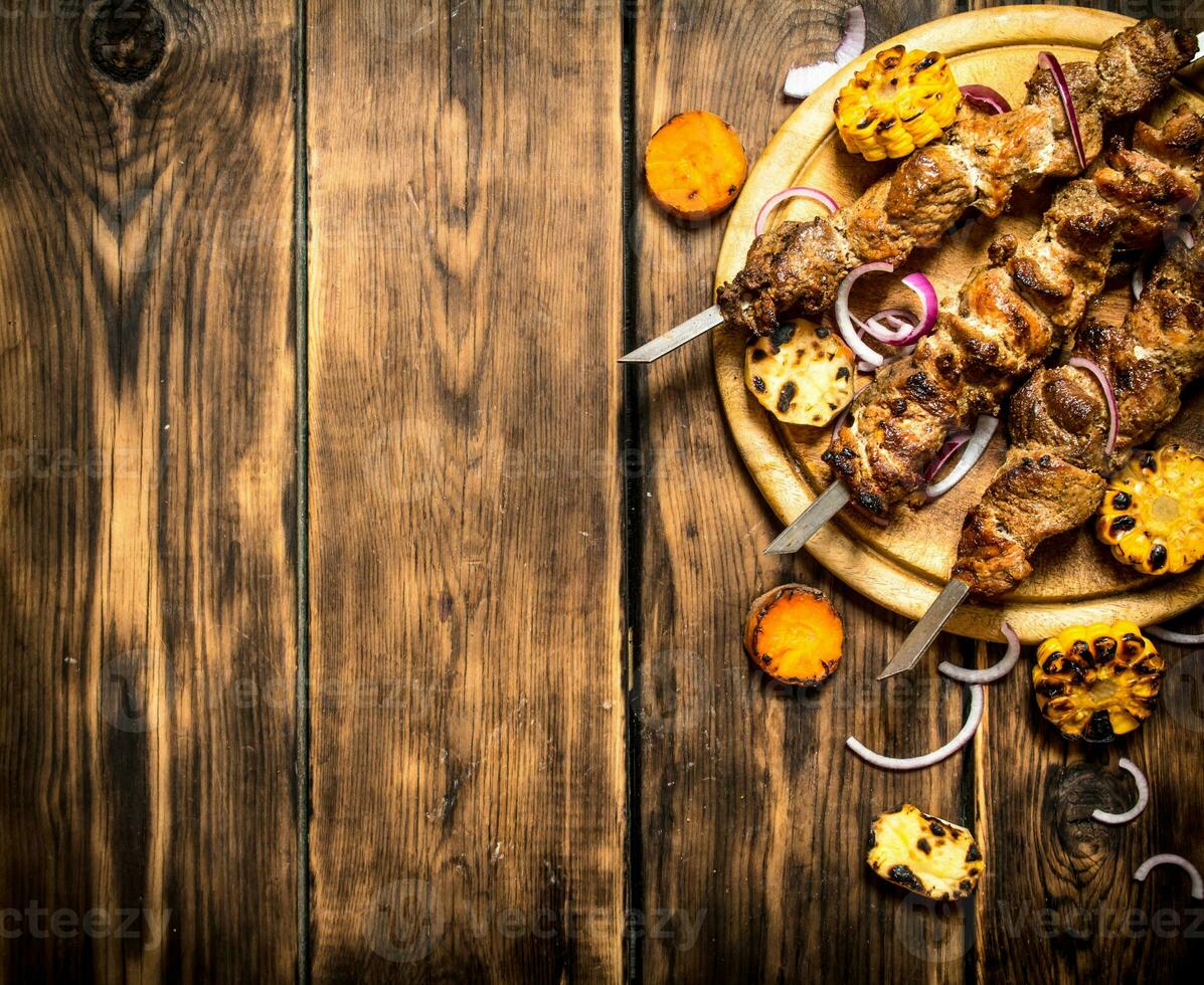 Shish kebab with grilled vegetables. photo