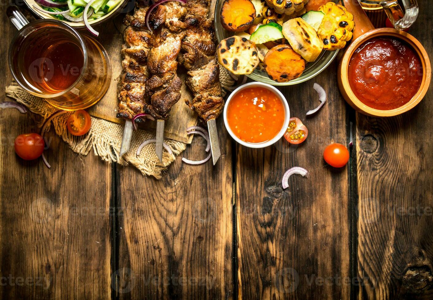 Grilled vegetables with a fragrant Shish kebab from mutton. photo