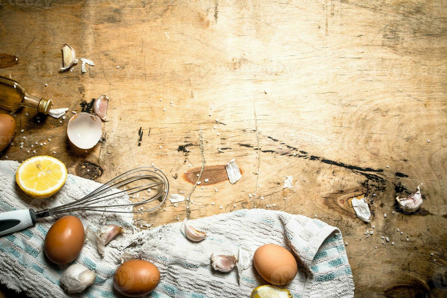 Making mayonnaise from eggs, garlic and lemon. photo