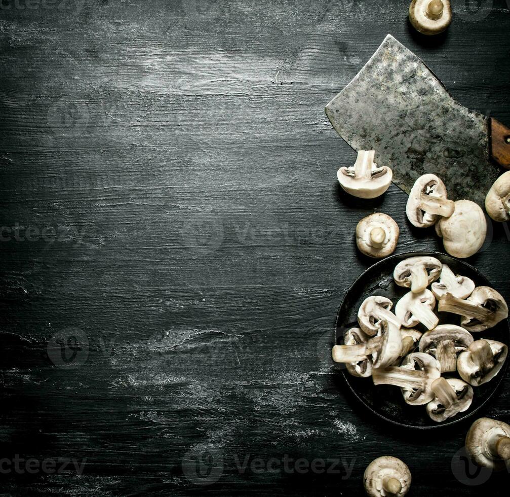 Fresh sliced mushrooms with the hatchet. photo